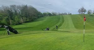 Jon Prichard plays his 5th shot at the 4th hole, having putted his 4th from within 8 feet of the hole (following Andrew Garden down the hill after he had also putted off the green), then played his 6th shot from almost the same spot! Many groups felt the pin position rather unfair on the speedy greens!