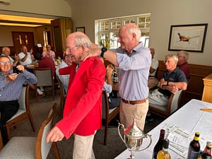 Presentation of the winners' red jacket to Hall Captain, Chris Atkinson